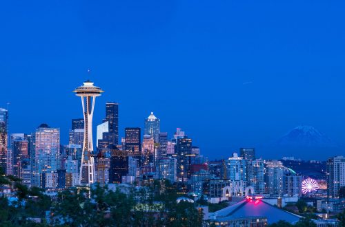 A beautiful view of the city of Seattle, USA with the colorful lighted buildings at dusk