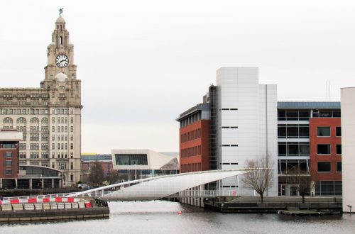 Water channels in Liverpool, United Kingdom. Modern buildings, Royal Liver Building, cloudy weather